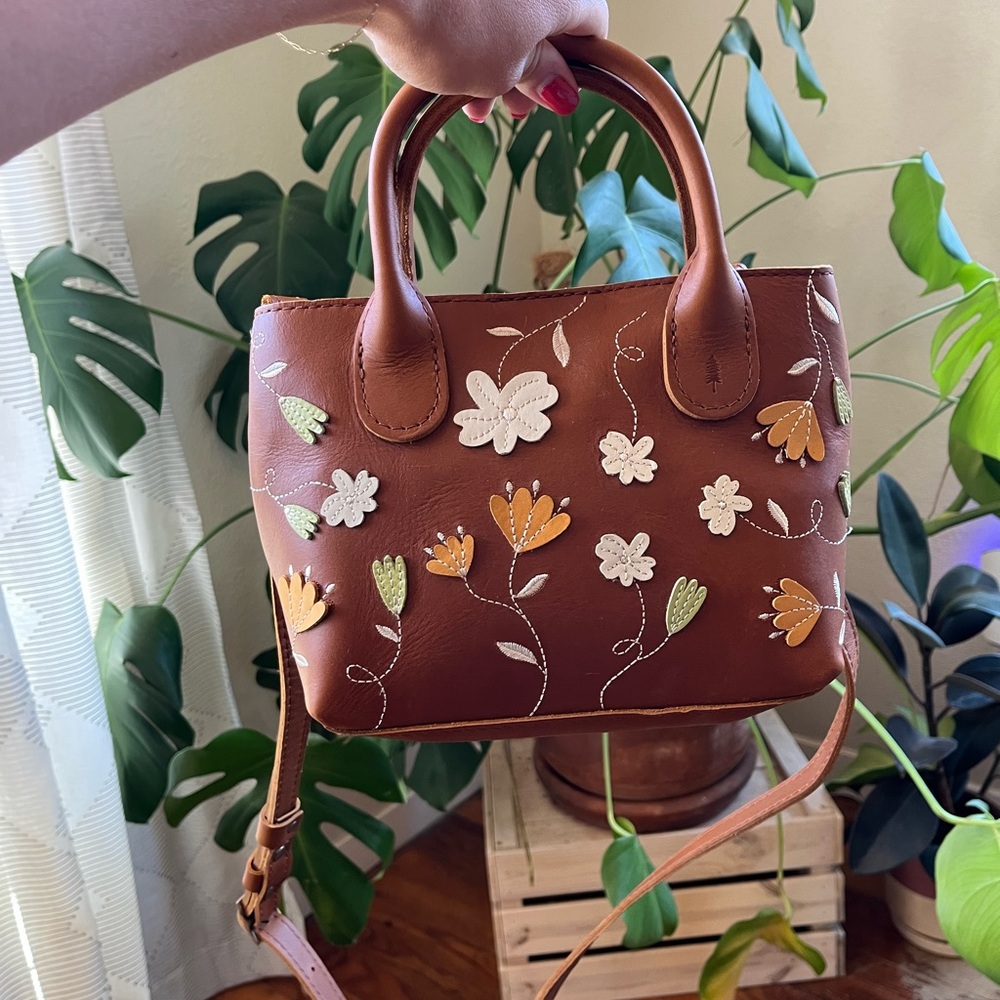 Portland Leather Goods “Folklore” Brown Crossbody Bag with Floral Embellishments